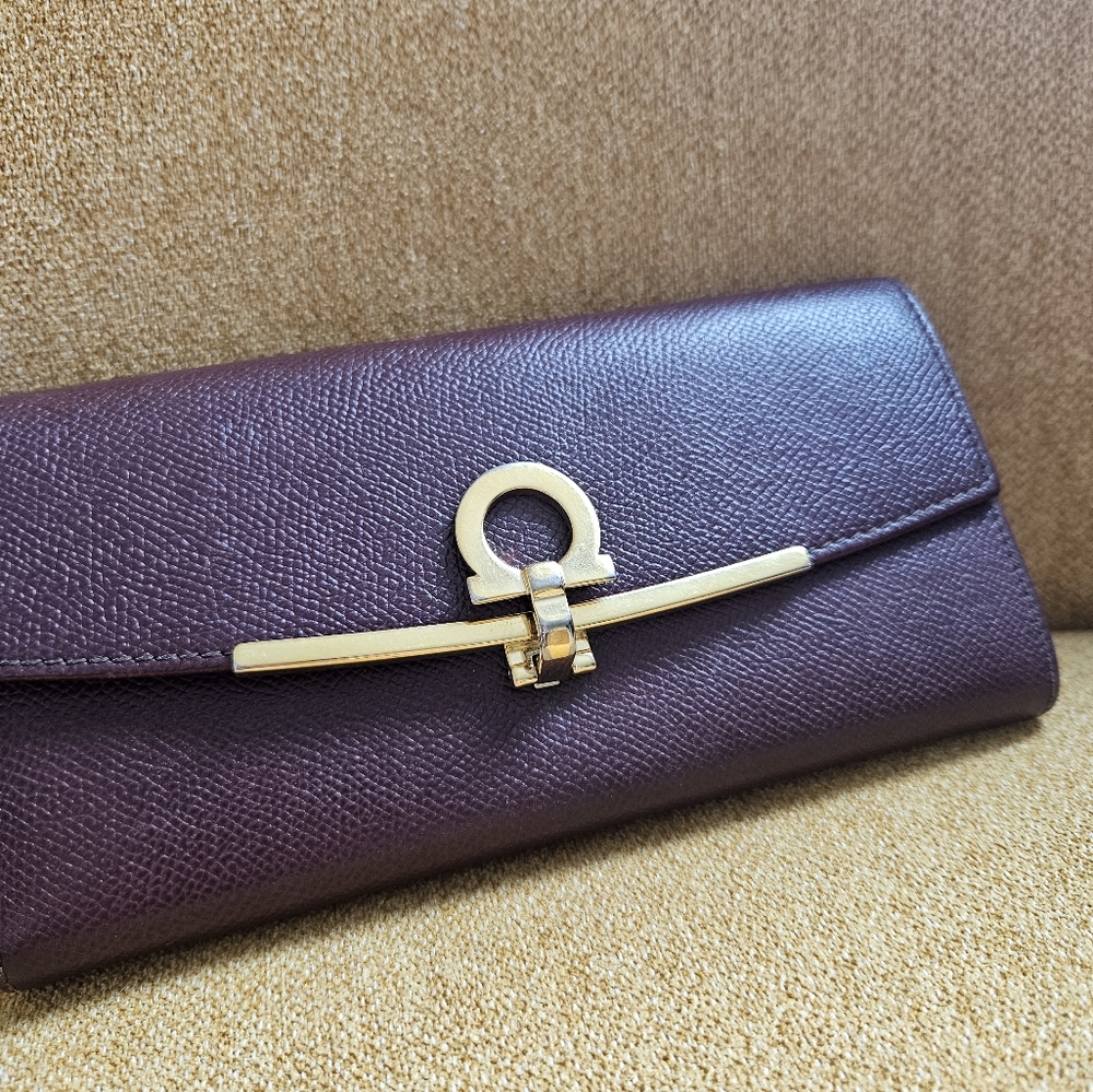 Authentic Salvatore Ferragamo WOC. Merlot Color With Gold Hardware.
